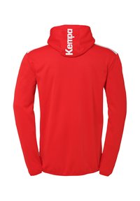 Red long-sleeve hoodie in soft fabric with contrasting white accents on shoulders. Features a large white brand logo on the back.