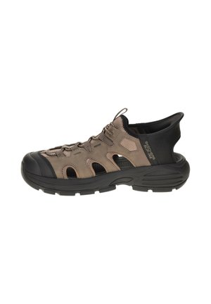 Brown and black Skechers slip-on sandal with closed toe, breathable cutouts, lace-up front, and thick cushioned sole.