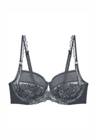Černá krajková podprsenka s květinovou výšivkou, průhlednými košíčky, volánkovými řemínky a žebrovaným páskem. Uprostřed se nachází malý akcent ve růžovém zlatě.