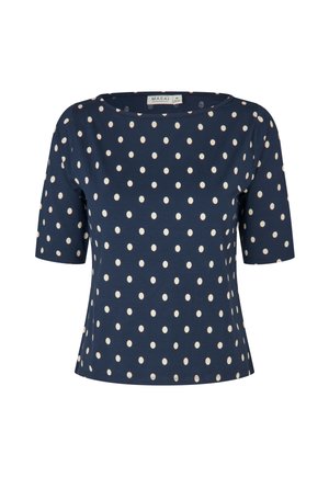 Navyblaues Kurzarmshirt mit einem Punktenmuster in Creme. Hat einen weiten Ausschnitt und eine lockere Passform. Weicher, dehnbarer Stoff.