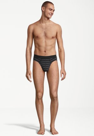 Slip da uomo a strisce nere con fascia in vita nera uniforme. Realizzati in tessuto morbido, progettati per una vestibilità aderente. Presentano uno stile minimalista.