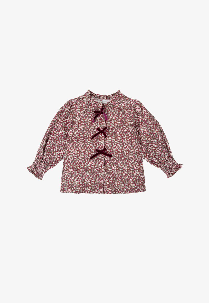 Blusa de patrón floral rojo con mangas largas y abullonadas, puños fruncidos y tres lazos de terciopelo en la parte frontal.