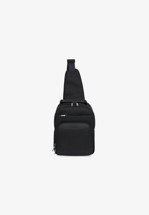 Borsa a tracolla nera realizzata in tessuto testurizzato, caratterizzata da una sola tracolla, due scomparti con zip e una forma rettangolare elegante.