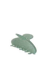 Clip para el cabello de purpurina verde con una forma redondeada similar a una mariposa, que presenta una textura suave y múltiples dientes de agarre en la base.