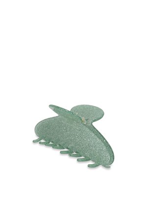 Fermaglio per capelli verde glitterato con una forma tondeggiante simile a quella di una farfalla, caratterizzato da una superficie liscia e da numerosi denti di bloccaggio alla base.