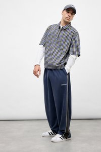 IF PANELLED HARRI BAGGY UNISEX - Pantalon de survêtement - blue