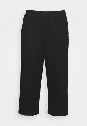 Pantalons noirs 3/4 en tissu doux, dotés d'une taille élastique et d'une coupe droite sans embellissements ni motifs visibles.