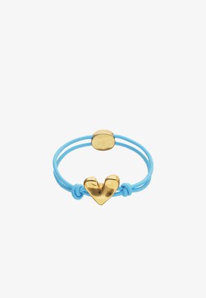 Élastique à cheveux bleu avec un charme en forme de cœur brillant doré et une petite fermeture ronde dorée.