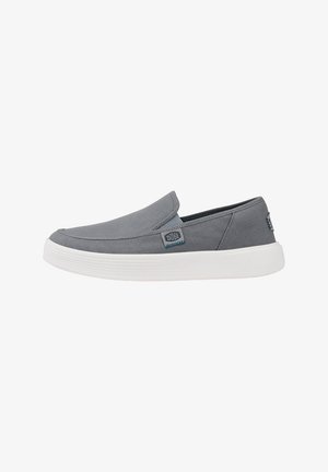 Gray slip-on shoes made of fabric with a textured finish, elastic side panels, and a white rubber sole; features a logo tag on the side.