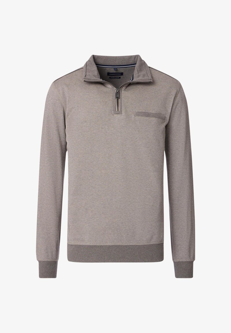 Grå långärmad tröja med dragkedja vid kragen, strukturerad tyg och en bröstficka. Har ribbad mudd och fåll för en figurnära look.