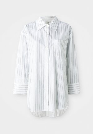 White long-sleeve button-up shirt with thin black vertical stripes, a left chest pocket, and a pointed collar.