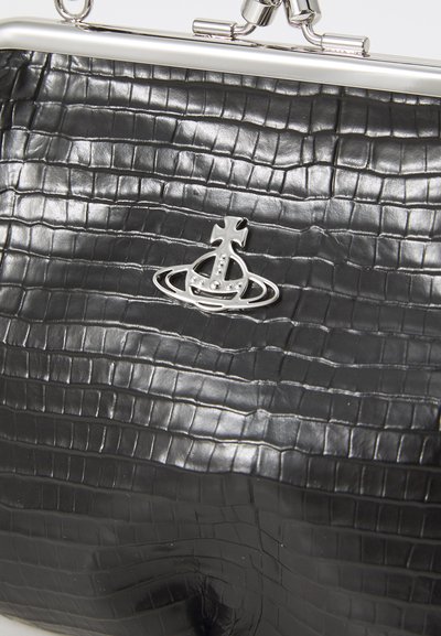 Black faux leather handbag with a crocodile texture, silver hardware, and a prominently featured decorative badge on the front.