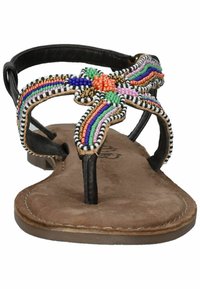 Gevlochten platte sandalen met een zwart strappy ontwerp. Kenmerkt een meerkleurig beadpatroon in een bloemblaadjesvorm op een tan suède voetbed.