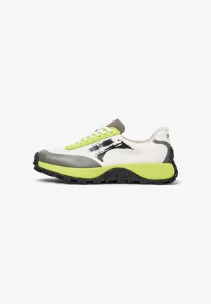Sporty sneaker in white, gray, and neon green with a textured black sole and decorative black brush stroke on the side.