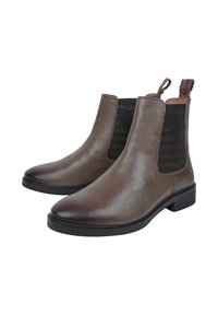 Brune læder ankelstøvler med elastiske sidepaneler, rund tå og en sort gummisål. Tekstureret læder med en trækflap bagpå.