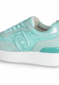 Mint green sneaker with a mix of glossy and suede textures. Features tonal stitching, lace-up design, and a patterned sole accent.
