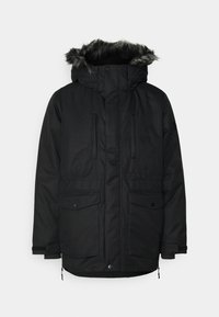 Parka negra con capucha forrada de piel, cierre frontal con cremallera, dos bolsillos grandes y puños ajustables. Fabricada con material resistente al clima.
