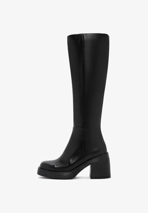 Black knee-high boots made of smooth leather with a block heel, rounded toe, and minimalistic design. Seam detailing along the side.
