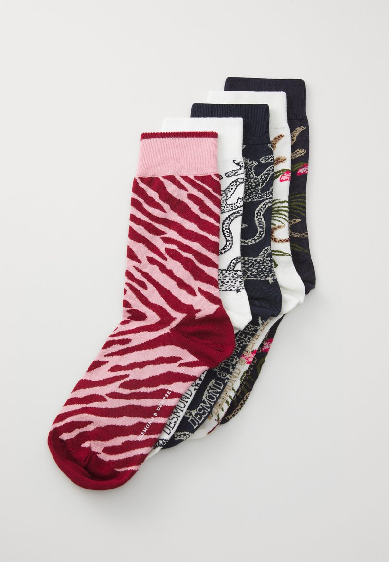 Five pairs of socks: one pink zebra pattern, three solid colors (white, navy), and one with various printed designs in intricate details.