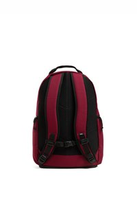 Red and black backpack with a structured shape, mesh back panel, adjustable straps, and a top handle for ease of carrying.