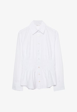 Camicia bianca a maniche lunghe con colletto a punta e dettaglio elastico arricciato in vita.