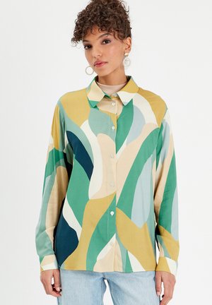 Button-up shirt featuring a multicolored abstract design in greens, yellows, and beiges. Long sleeves and a standard collar. Smooth fabric.