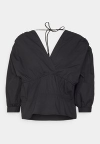 Blouse noire à manches longues avec un décolleté en V profond, taille froncée et détail noué à l'arrière. Confectionnée dans un tissu léger à texture lisse.