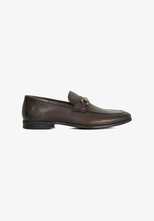 Brown leather loafers with a smooth texture, a decorative strap with hardware, slim silhouette, and rounded toe. Flat rubber sole.