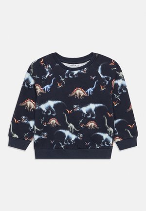 Children's navy blue long-sleeve sweatshirt with colorful dinosaur and flying pterosaur prints all over.