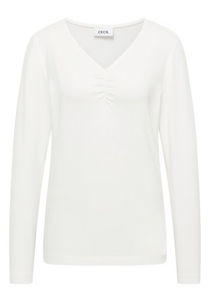Top blanco de manga larga con escote en V y detalles fruncidos en el pecho. Textura suave y diseño ajustado. Etiqueta de la marca: CECIL.
