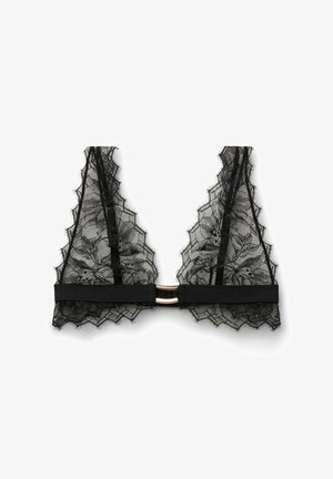 Bralette en dentelle noire avec motifs floraux, bords festonnés, tissu transparent, bretelles réglables et fermeture avant en métal doré sur fond blanc.