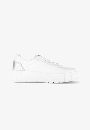 White low-top sneaker with thick sole and metallic silver heel accent, featuring white laces and detailed stitching on side panels.