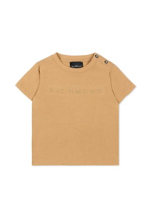 Beige korte mouw peuter T-shirt met geperforeerd "John Richmond" logo en twee zwarte knopen op de linkerschouder.
