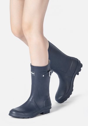 Navy rubber rain boots with a textured sole, adjustable buckle detail, and a rounded toe, designed for waterproof performance.