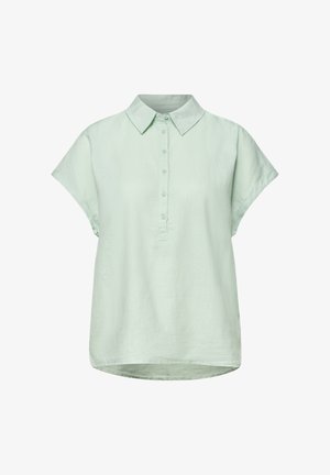 Blouse vert clair à manches courtes avec col pointu et patte de boutonnage à cinq boutons, coupe ample, ourlet légèrement asymétrique, tissu uni.