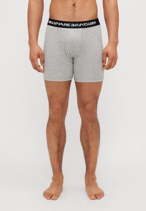 Grå boxershorts laget av et mykt materiale med svart elastisk midjebånd som har "Billionaire Boys Club"-logoen i hvitt.