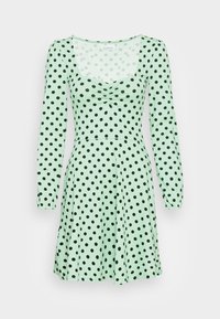 Vestido verde com mangas compridas, apresentando um decote quadrado e bolinhas pretas. O tecido é suave, com corpete ajustado e saia rodada.