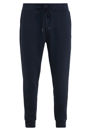 Pantalones deportivos de color azul marino hechos de una suave mezcla de algodón; banda elástica en la cintura con cordón, tobillos ajustados y bolsillos laterales.