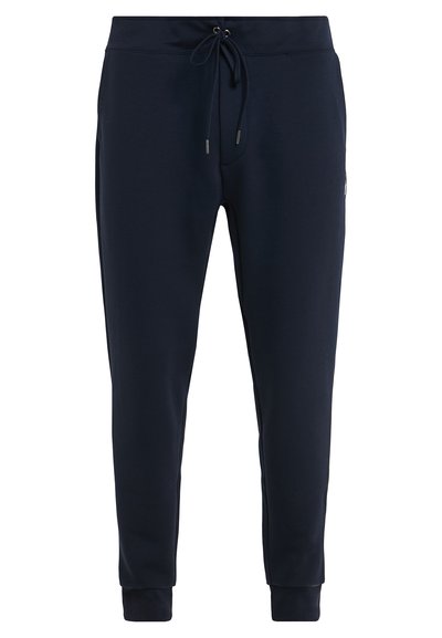 Pantalons de survêtement bleu marine en mélange de coton doux ; taille élastique avec cordon de serrage, chevilles resserrées et poches latérales.