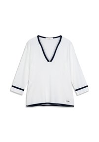 Haut blanc à col en V avec manches trois-quarts, bordé de bleu marine au niveau de l'encolure et des poignets, confectionné dans un tissu doux et texturé.