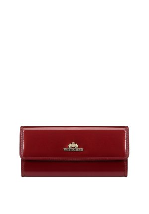 Red patent leather wallet with a metallic logo accent, featuring a smooth, glossy texture and a flap closure design.