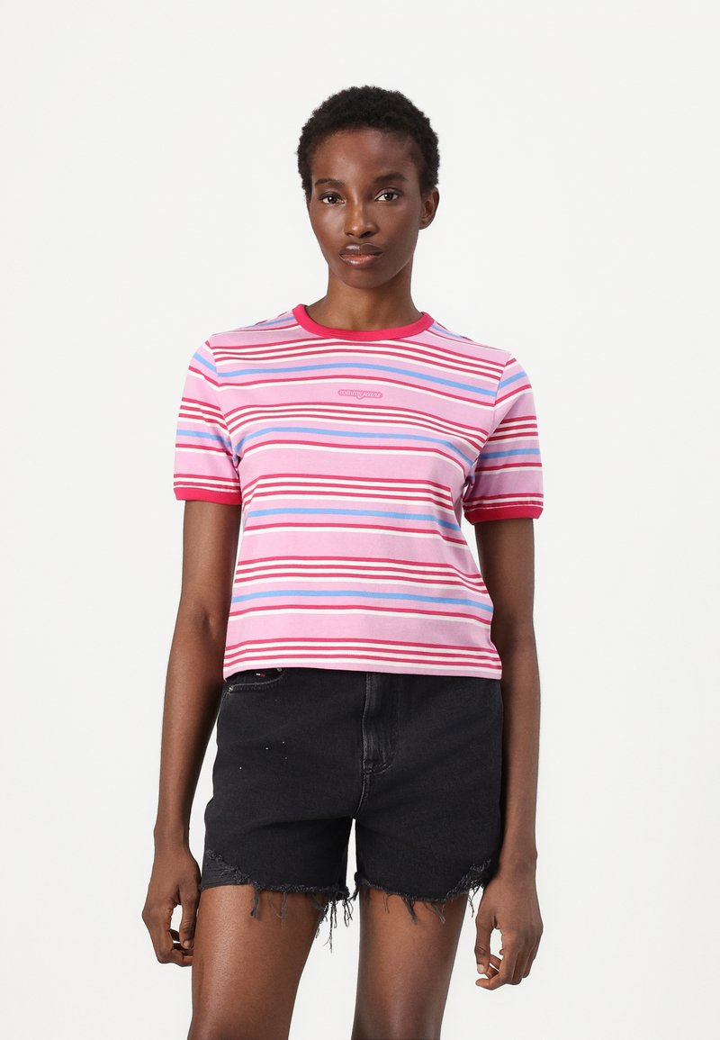 Short-sleeve pink striped t-shirt with blue, red, and white horizontal stripes. Ribbed crew neck and logo printed on front.