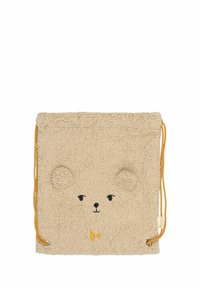 Beige plyschpåse med dragsko och björnansikte, med broderade detaljer, rundade öron och gula dragsnören. Mjuk textur, fyrkantig form.
