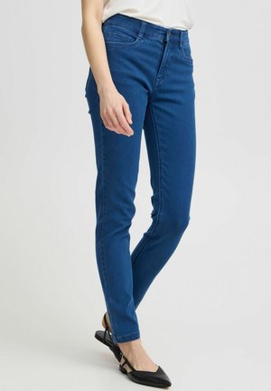 Modré džíny skinny s středním pasem, které mají hladkou texturu, klasický design s pěti kapsami a jemné detaily šití.