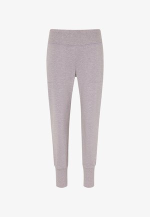 Jasnoszare dresy wykonane z miękkiego, elastycznego materiału. Posiadają elastyczny pas i ściągacze na mankietach, a także dwie boczne kieszenie.