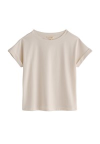 T-shirt crema a maniche corte con scollo rotondo. Tessuto morbido con vestibilità casual e maniche arrotolate. Nessun motivo o dettaglio visibile.