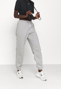 Reebok Tracksuit bottoms - grey