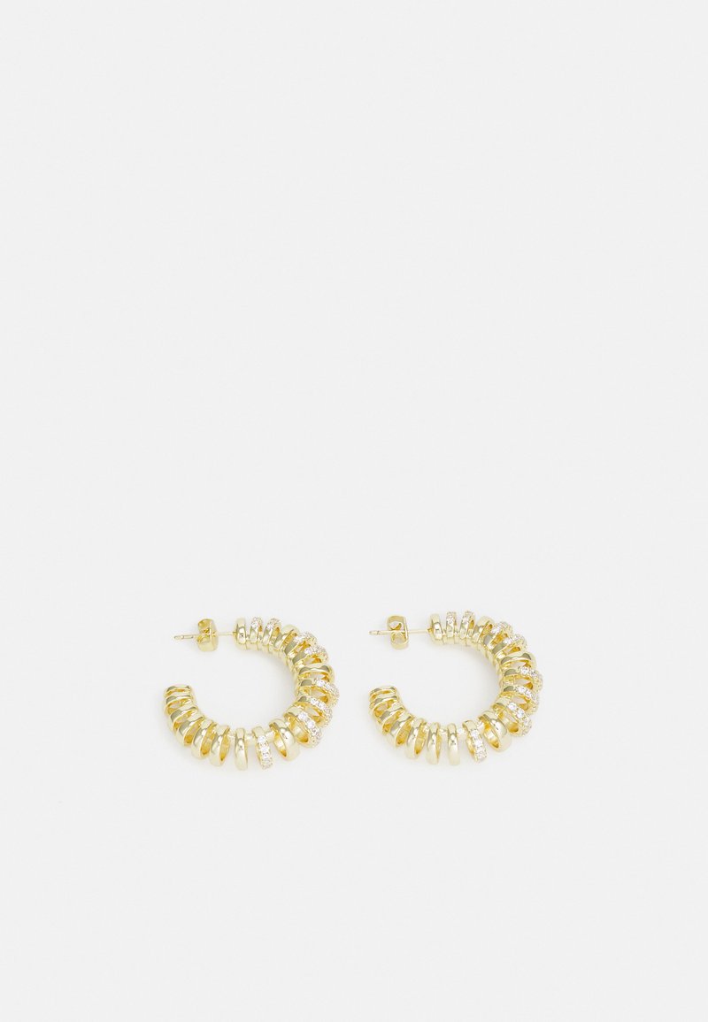 Gold-toned hoop earrings with a spiral design, featuring alternating smooth and textured sections, adorned with small clear accents.