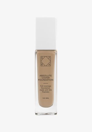 Flacon de fond de teint OFRA Absolute Cover beige avec bouchon blanc, étiqueté couvrance totale avec peptides de soie, volume 30 ml.