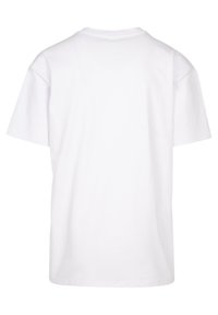 Hvid bomulds T-shirt, korte ærmer, rund halsudskæring, afslappet pasform, ensfarvet bagpå uden mønstre eller detaljer, glat tekstur.